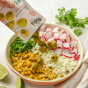 Lifestyle 1 of Poshi Premium Green Pitted Olives with Chili & Oregano - Olives For Charcuterie Boards - Pitted Green Olives - Low Calorie Olives